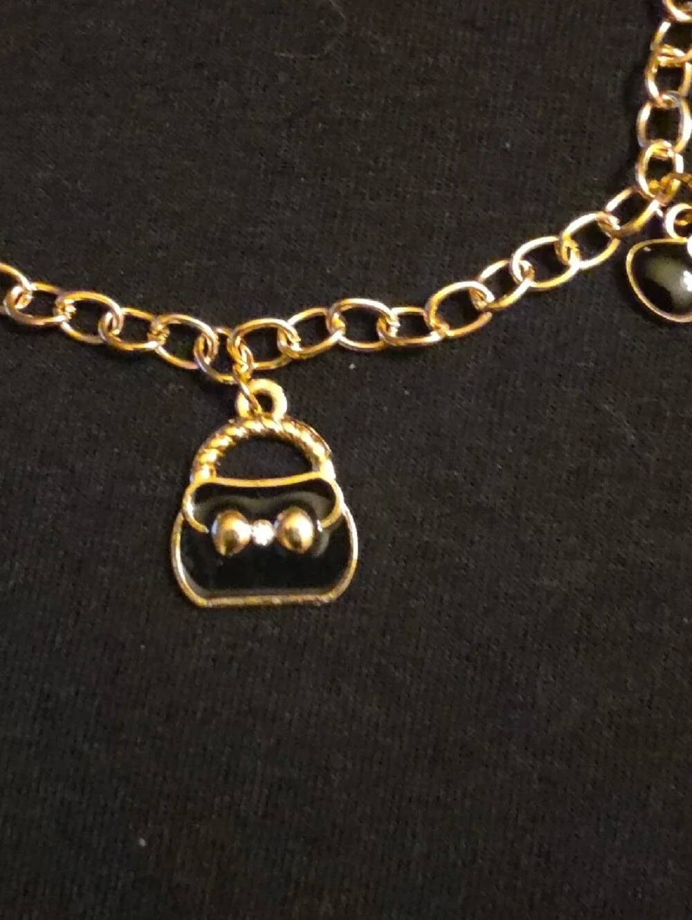 Gold-Tone Charm Bracelet with Purse, Bow and Coin Charms